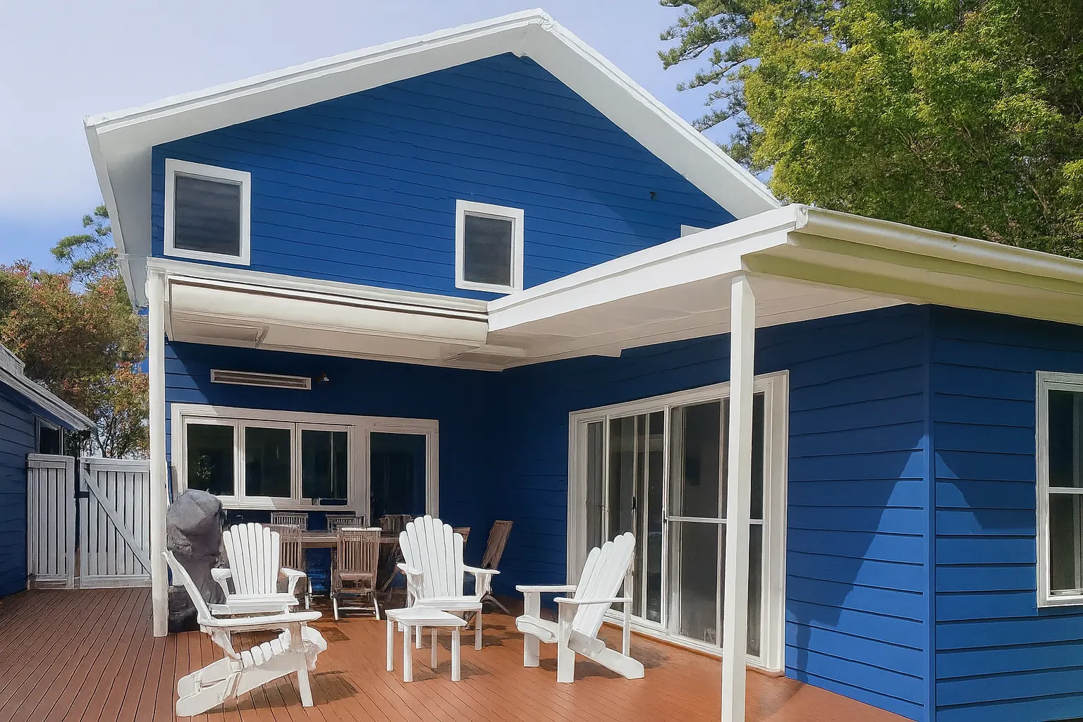 Striking blue weatherboard exterior with crisp white trims — a fresh coastal makeover on the Central Coast.